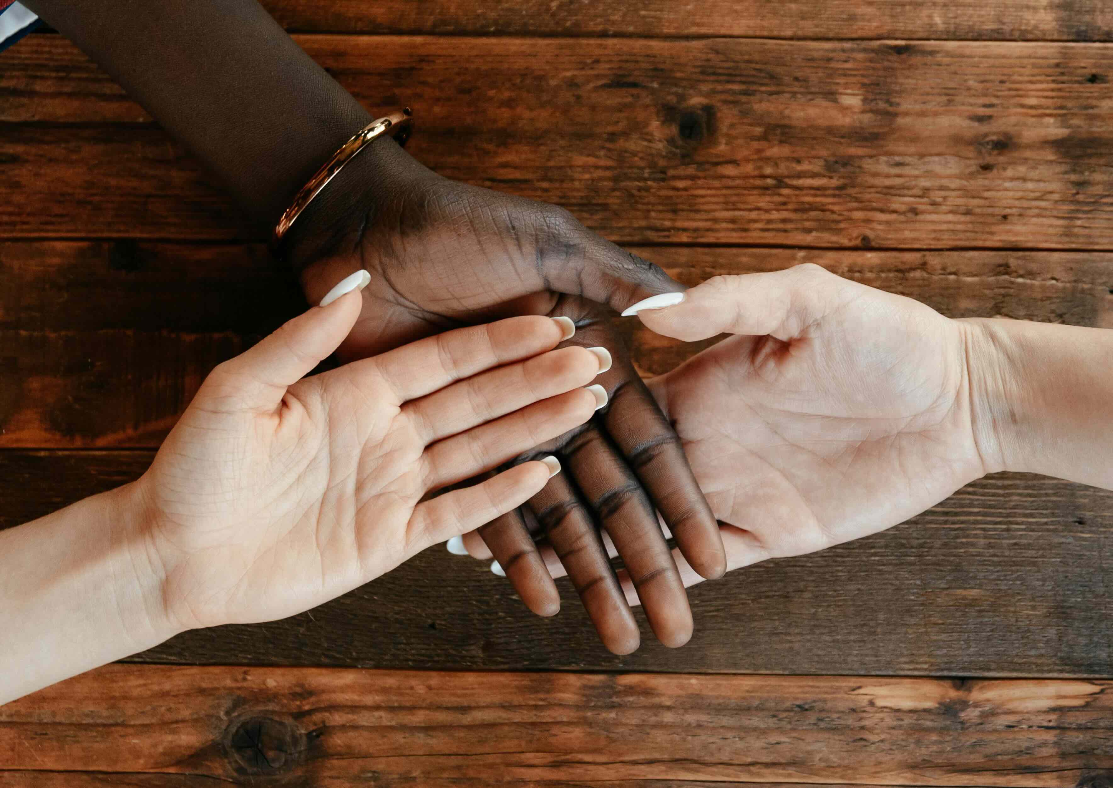 Woman using a laptop while sitting on the couch.