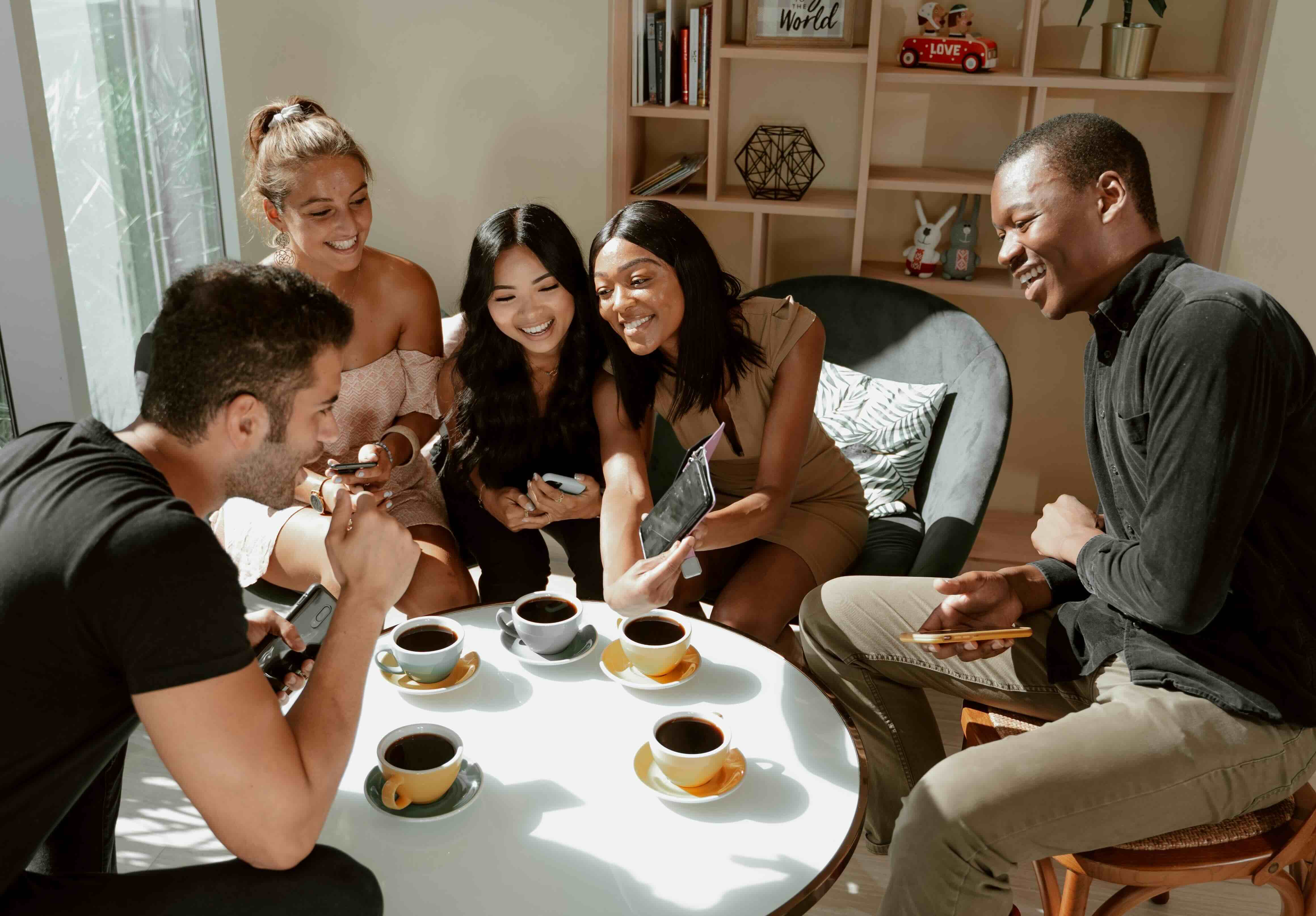 Woman using a laptop while sitting on the couch.